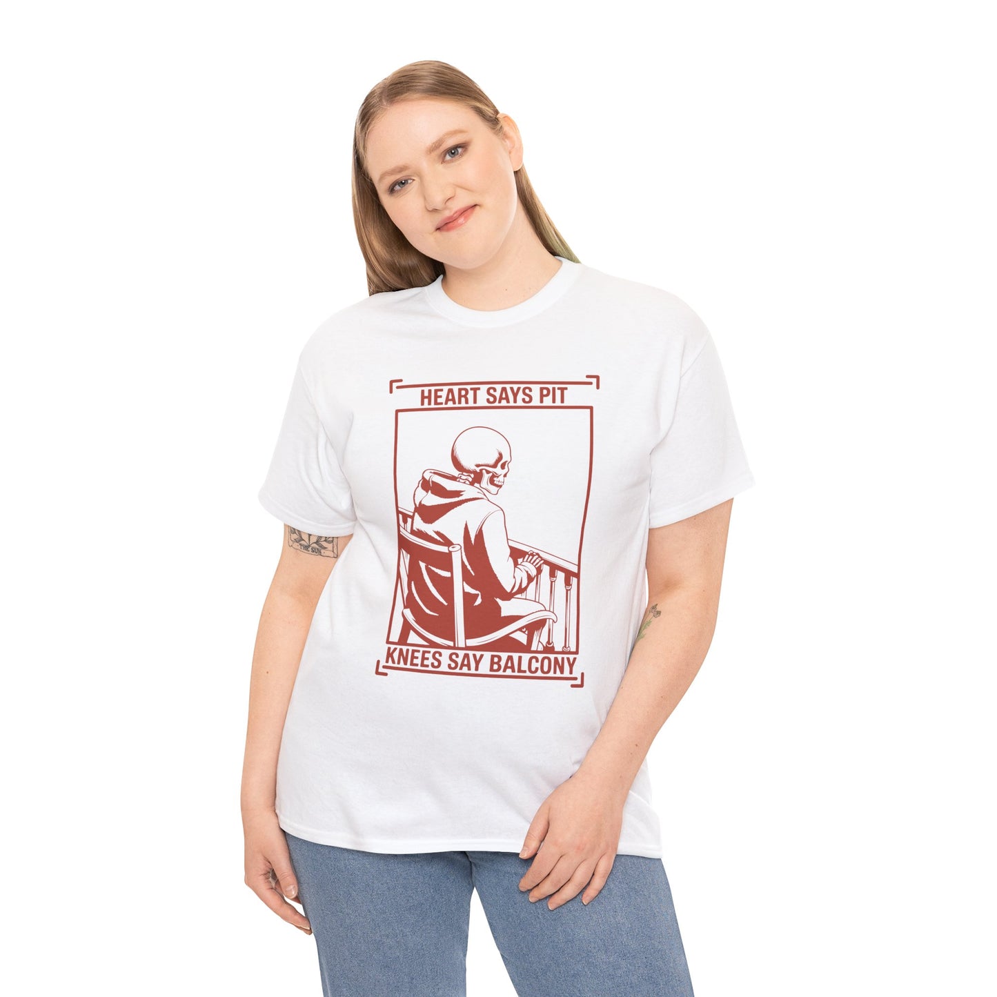 Female model wearing white “Heart Says Pit Knees Say Balcony” skeleton concert quote t-shirt, front view.
