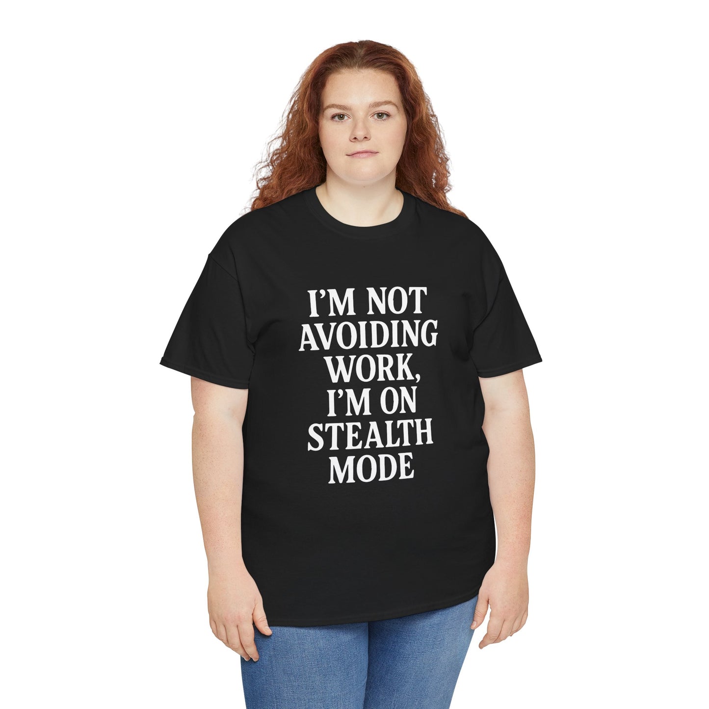 "Woman wearing black 'I'm Not Avoiding Work, I'm On Stealth Mode' work humor tee, front pose."