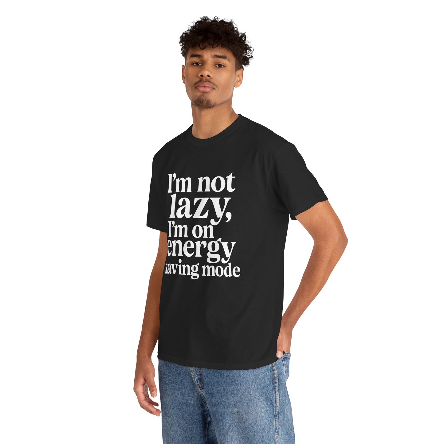 “Male model in Teezoca I’m Not Lazy I’m On Energy Saving Mode shirt, white typography graphic, black tee, casual pose.”