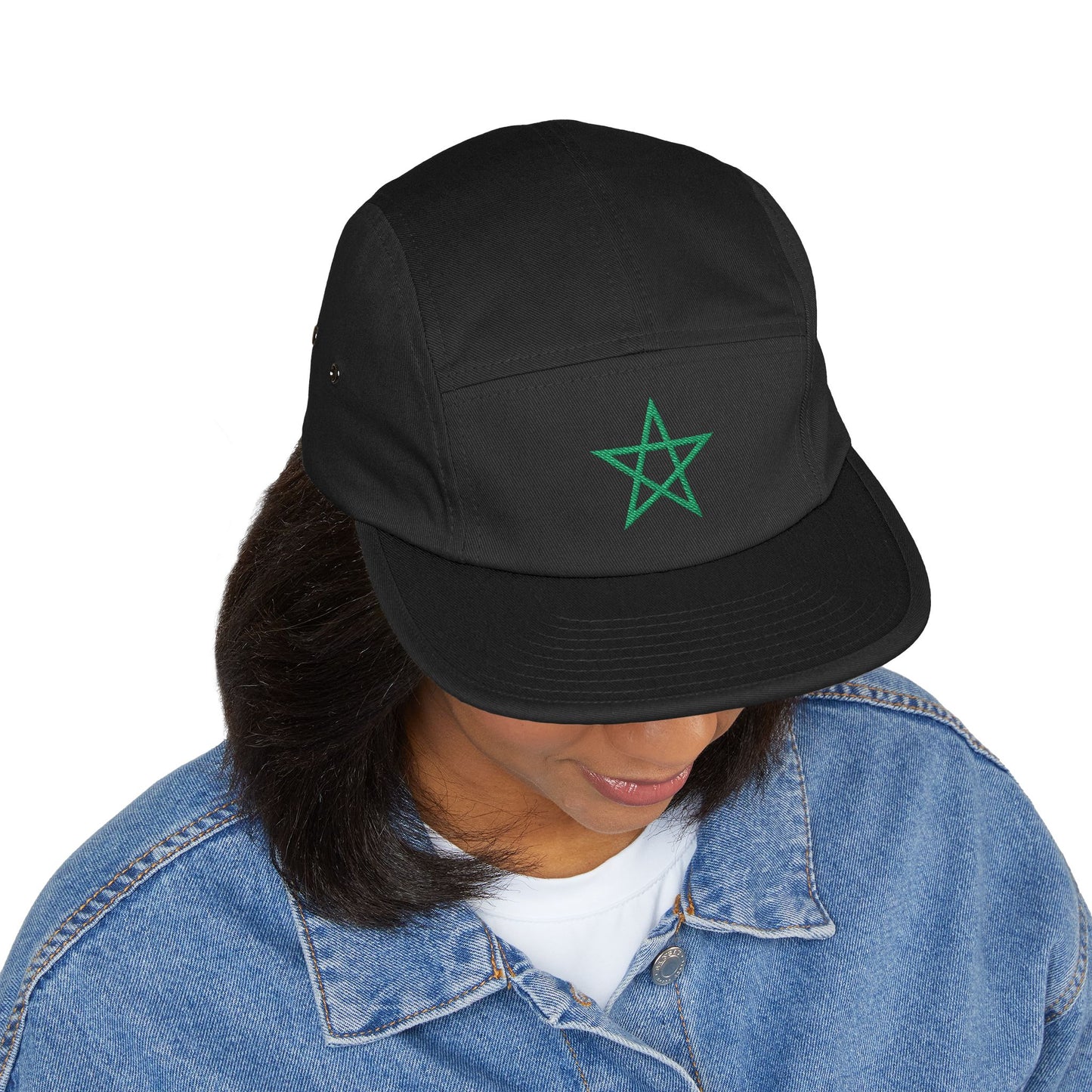 A woman looking down wearing a black TEEZOCA 5-panel Moroccan soccer supporter cap styled with a blue denim jacket.