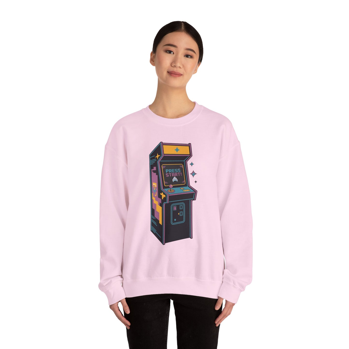 Classic video game arcade machine graphic sweatshirt for gamers Person wearing a pink sweatshirt with an arcade machine graphic on a white background
