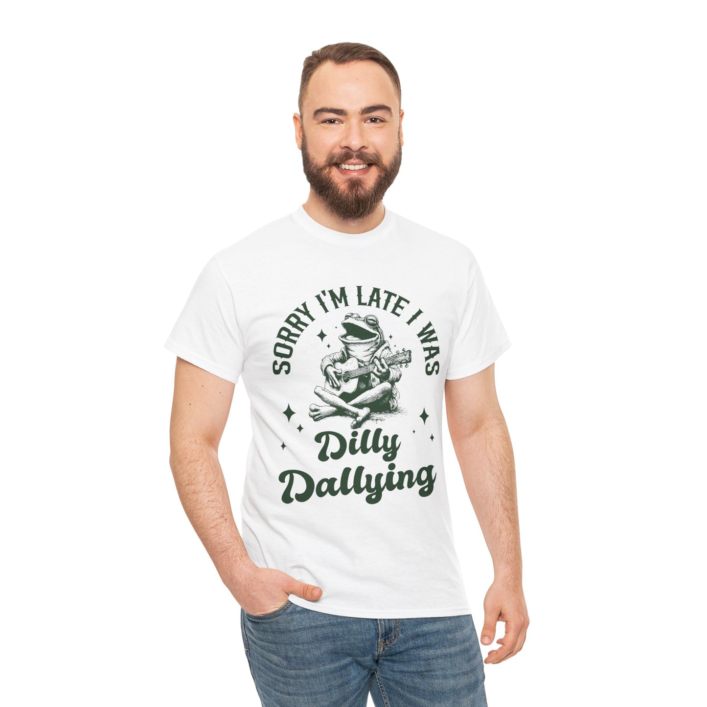 “Man model in Teezoca Sorry I’m Late I Was Dilly Dallying shirt, vintage frog with guitar, playful lateness meme, white casual graphic tee”
