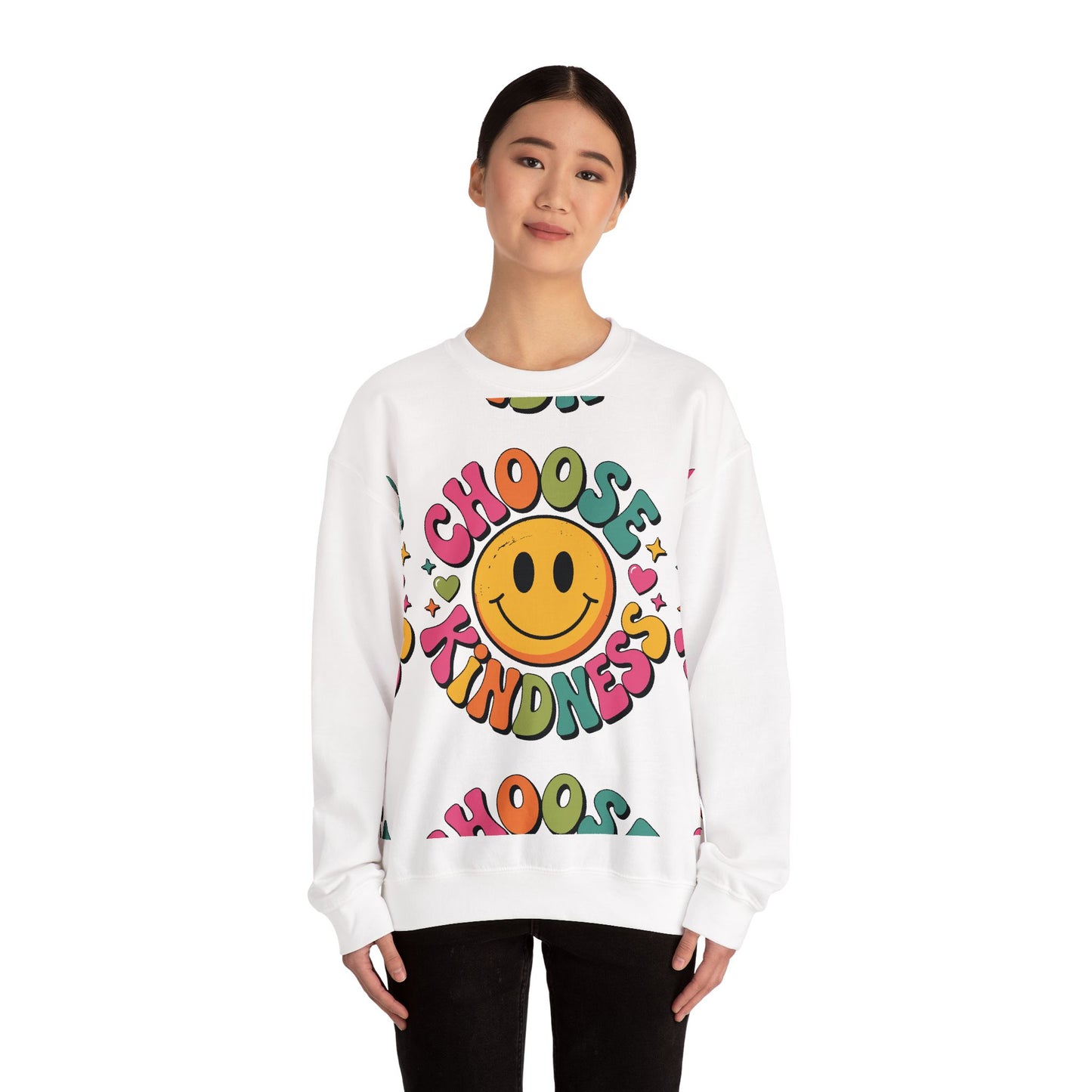 Positive message unisex sweatshirt featuring colorful smiley design Person wearing a white sweatshirt with a smiley face and 'Choose Kindness' text on a white background