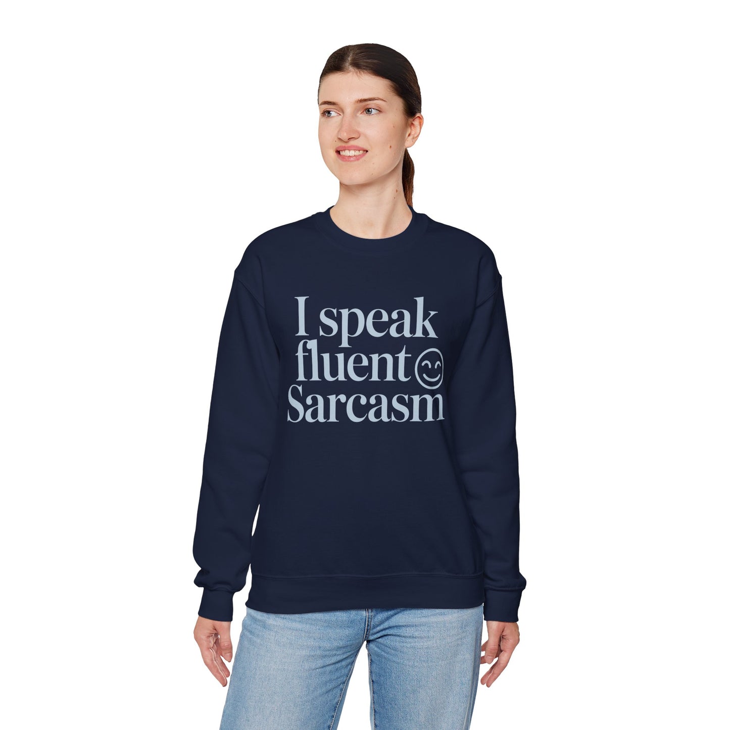 Sarcastic quote printed on a TEEZOCA unisex crewneck sweatshirt with clean text style Person wearing a navy sweatshirt with 'I speak fluent sarcasm' text on a white background