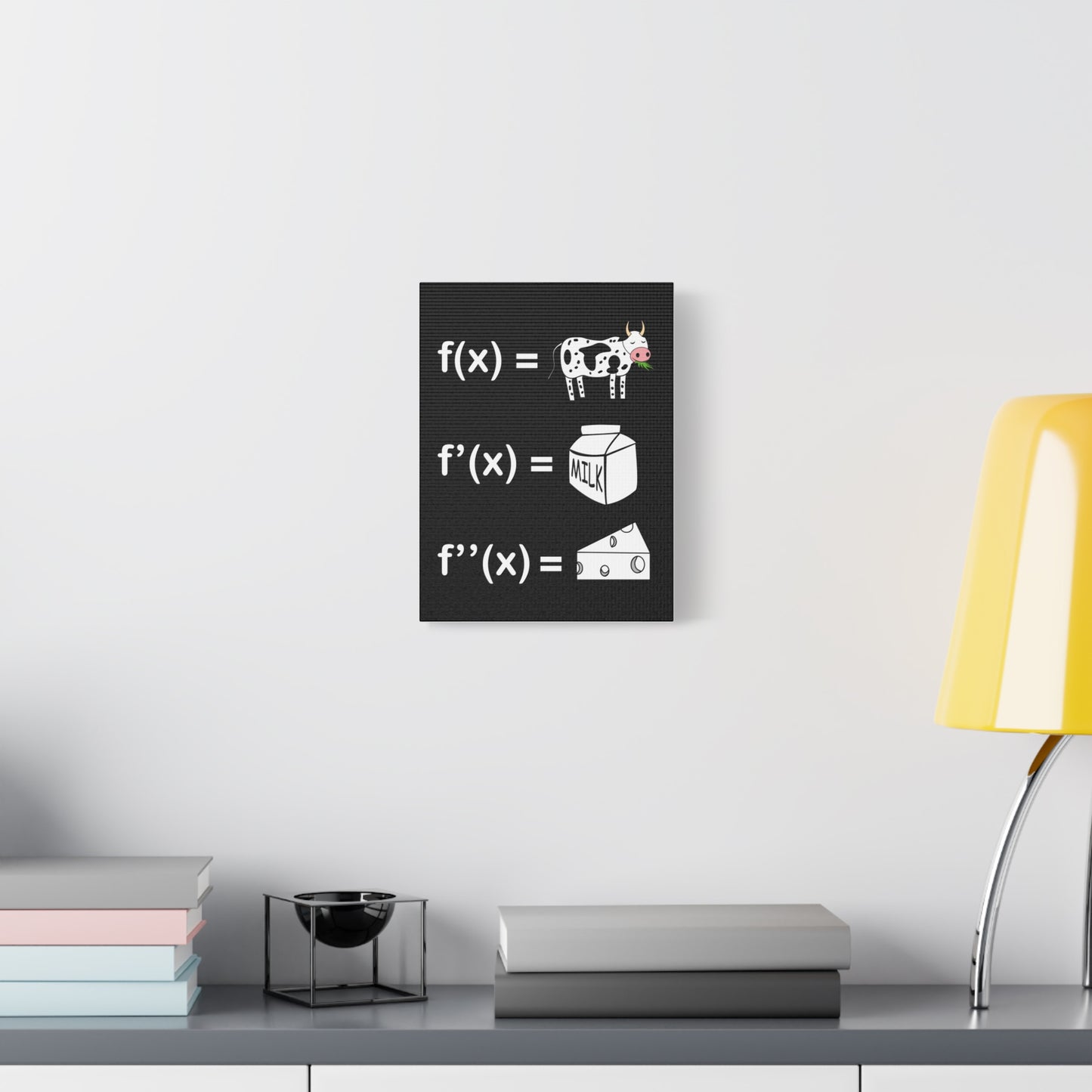 TEEZOCA STEM classroom derivatives wall art in a clean white room with plant and console.
