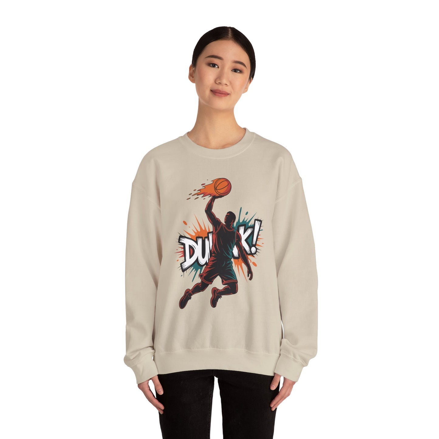 TEEZOCA basketball dunk sweatshirt with explosive street art slam dunk design Person wearing a beige sweatshirt with a basketball graphic and 'DUCK!' text on a white background