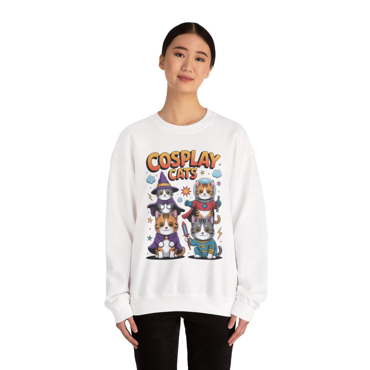 TEEZOCA cosplay cats sweatshirt with cats dressed as wizard and astronaut Person wearing a white sweatshirt with 'Cosplay Cats' design on a white background