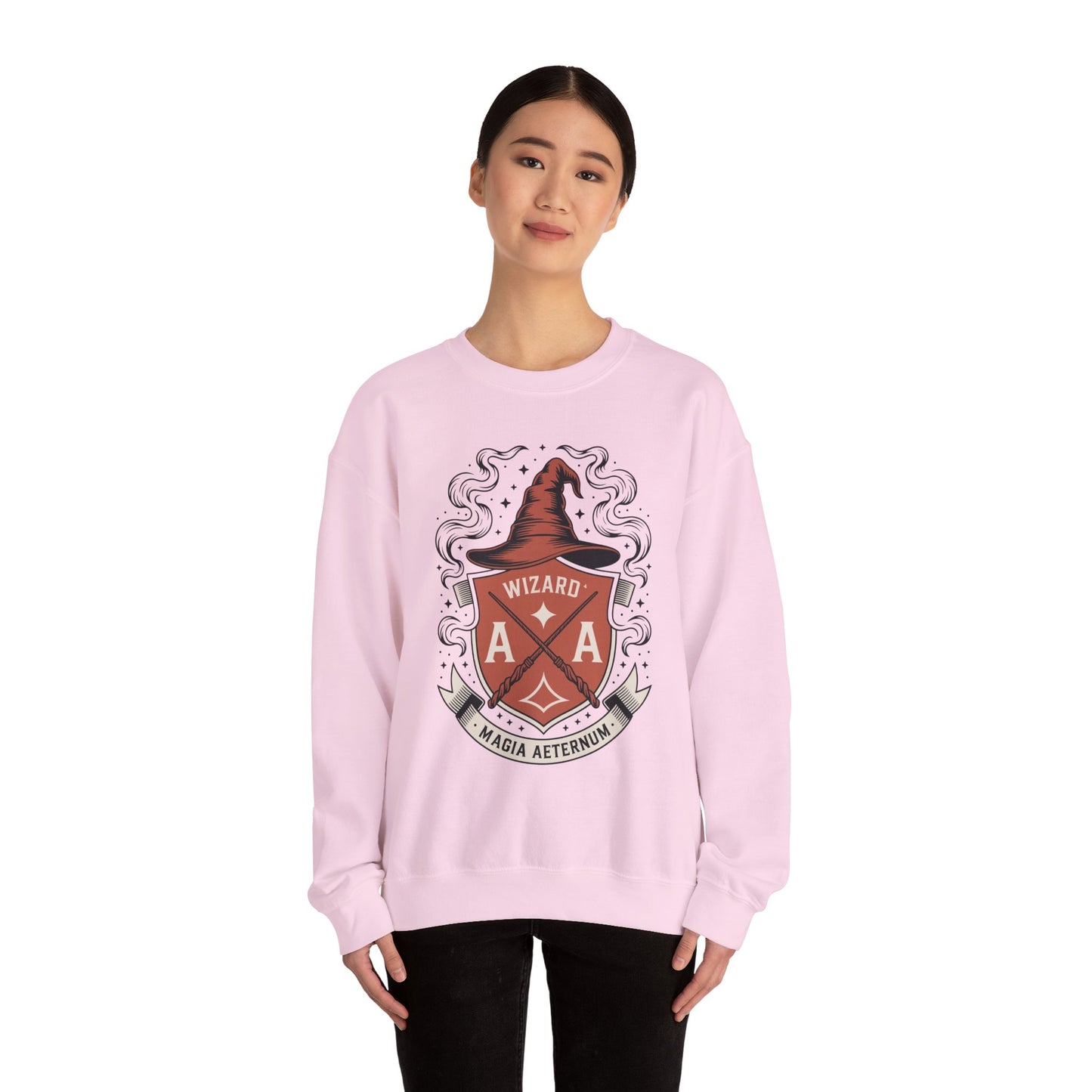 TEEZOCA wizard crest sweatshirt with magical fantasy emblem design Person wearing a pink sweatshirt with a crest design on a white background