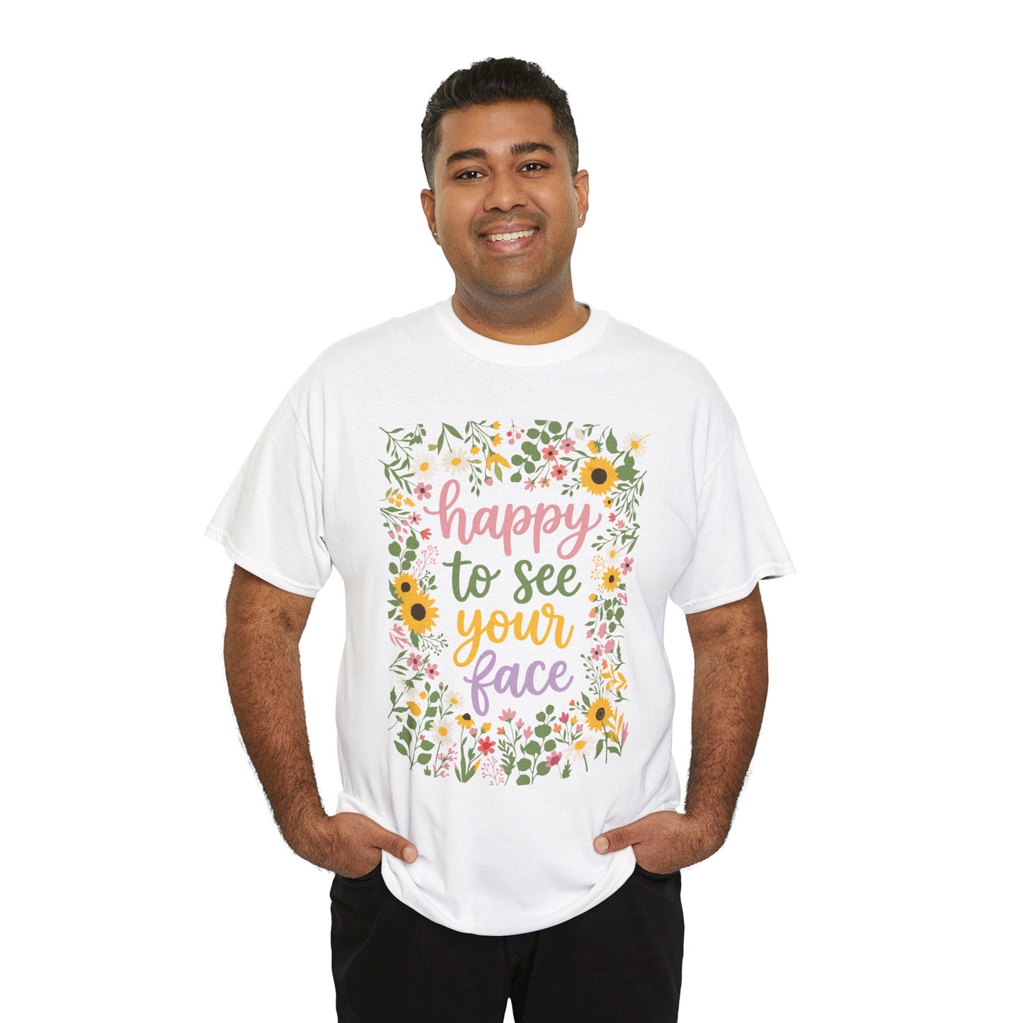 men wearing a White T-shirt featuring the phrase “Happy to See Your Face” in pastel lettering framed by a floral border with sunflowers and wildflowers.
