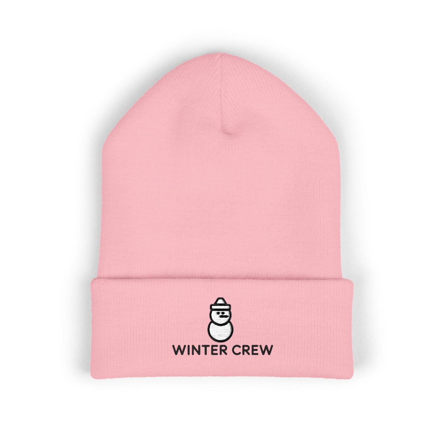 Pink beanie with 'Winter Crew' logo on a white background. Cozy winter beanie featuring cute snowman embroidery and Winter Crew text