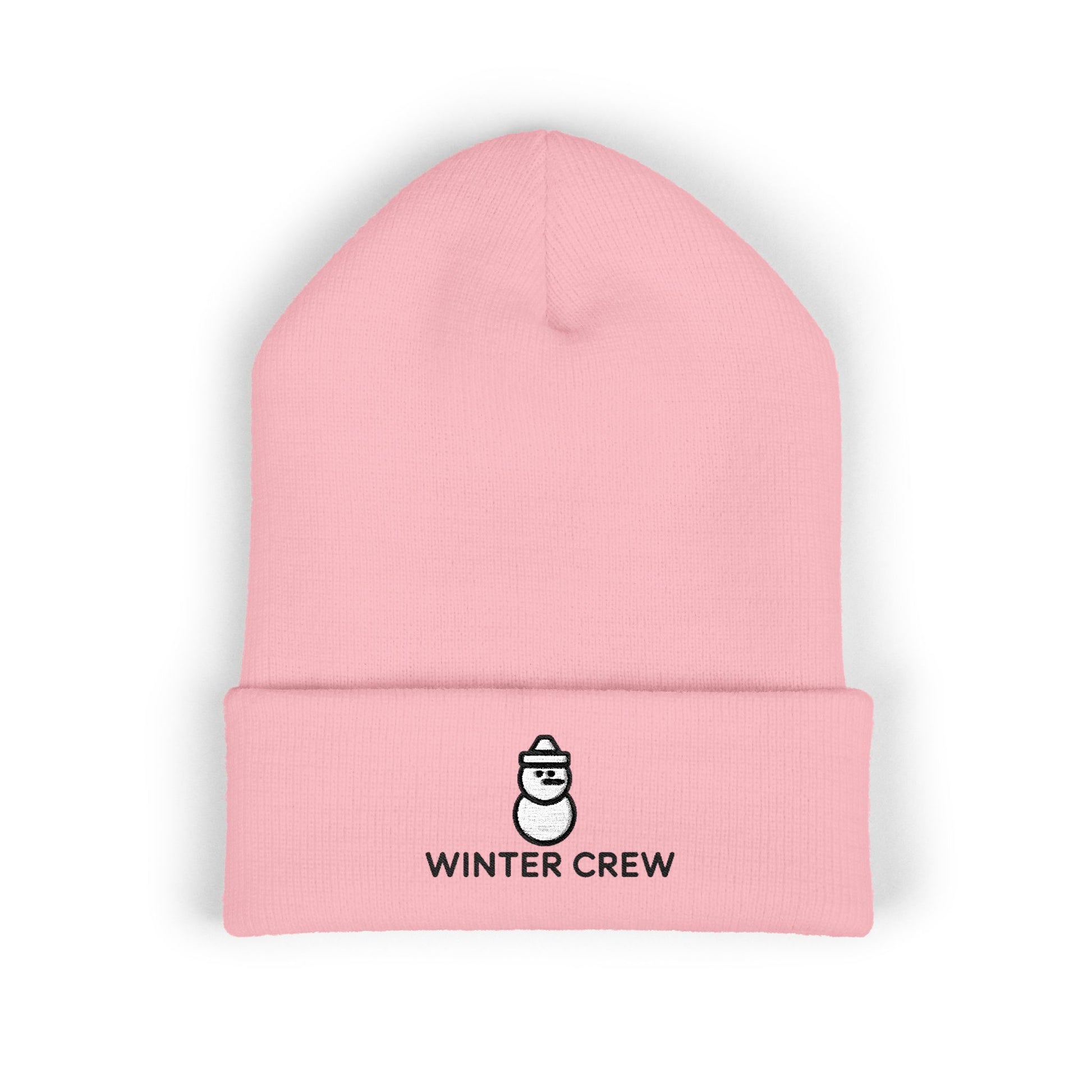 Pink beanie with 'Winter Crew' logo on a white background. Cozy winter beanie featuring cute snowman embroidery and Winter Crew text
