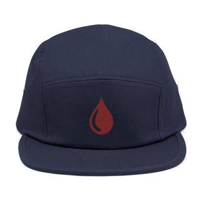 Navy blue cap with a red droplet symbol on a white background. Minimal coffee drop icon embroidered in a clean, modern style 5-panel cap. TEEZOCA