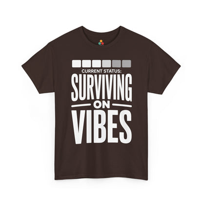 Brown t-shirt with white text 'CURRENT STATUS: Surviving on Vibes' on a white background | TEEZOCA