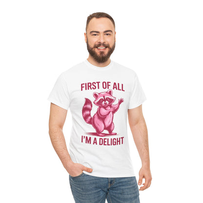 Man wearing a TEEZOCA “First Of All I’m A Delight” pink raccoon graphic t‑shirt.