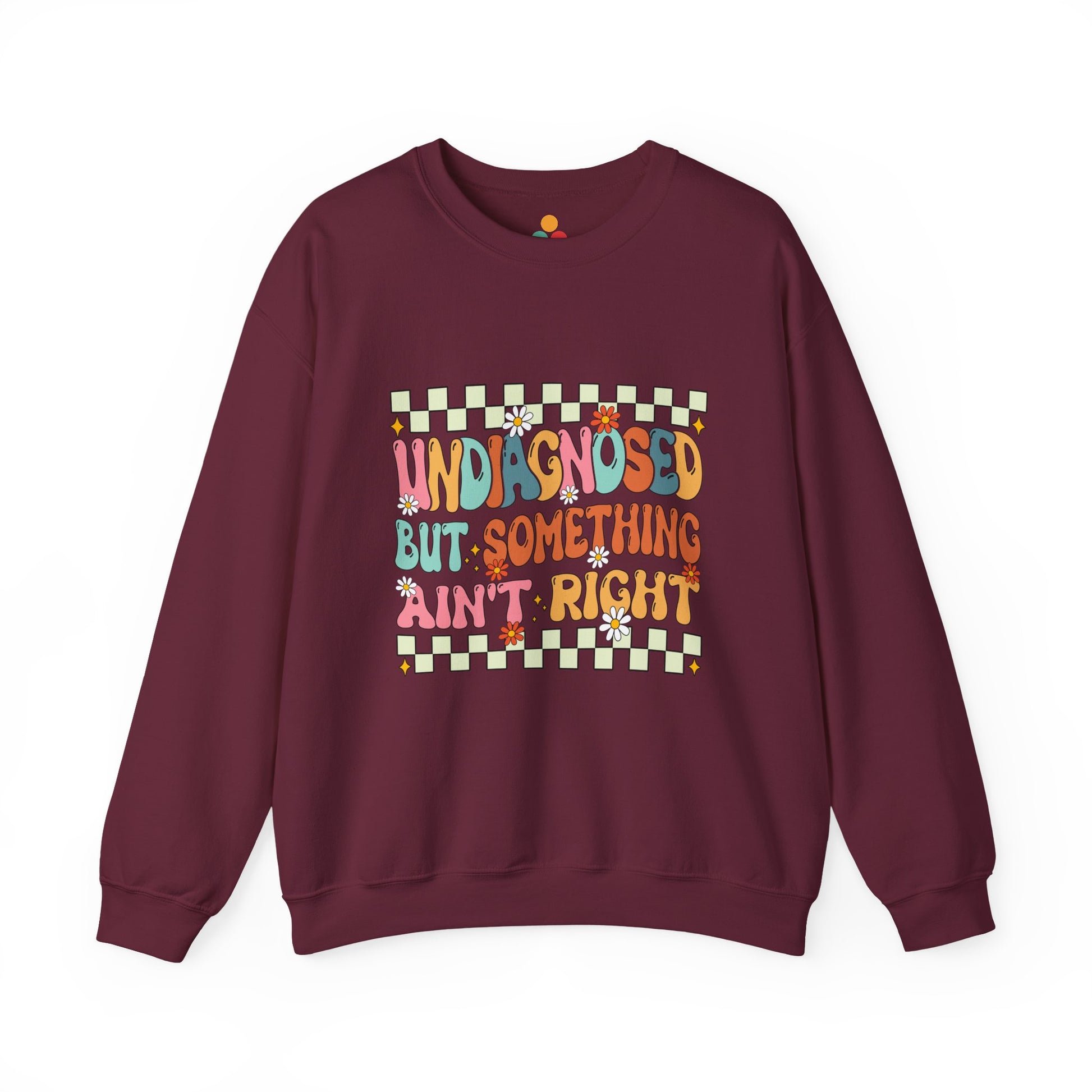 Maroon sweatshirt with colorful text and design on a white background