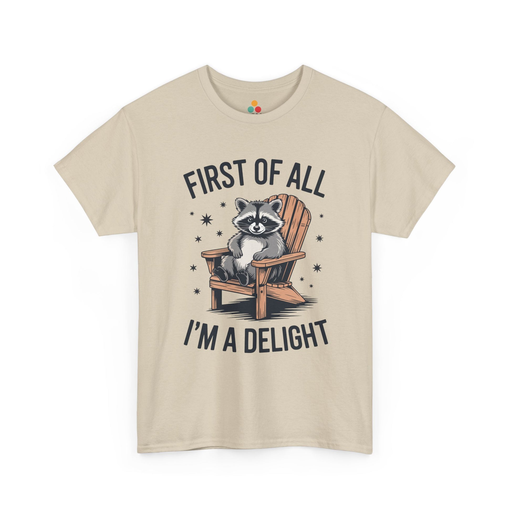TEEZOCA beige “First Of All I’m A Delight” raccoon chair tee displayed flat.