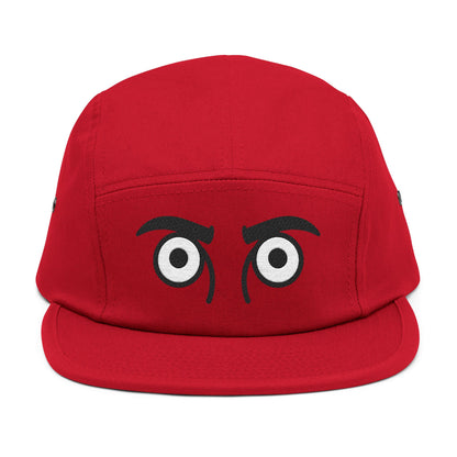 Red cap with cartoonish eyes on a white background. TEEZOCA