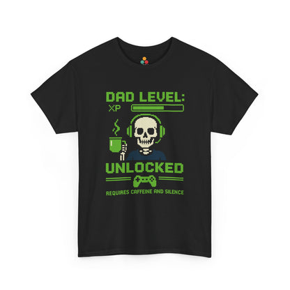 “Black t‑shirt with green pixel art skull in headset holding a coffee mug and text ‘Dad Level: XP Unlocked – Requires Caffeine and Silence’, flat front view.”

