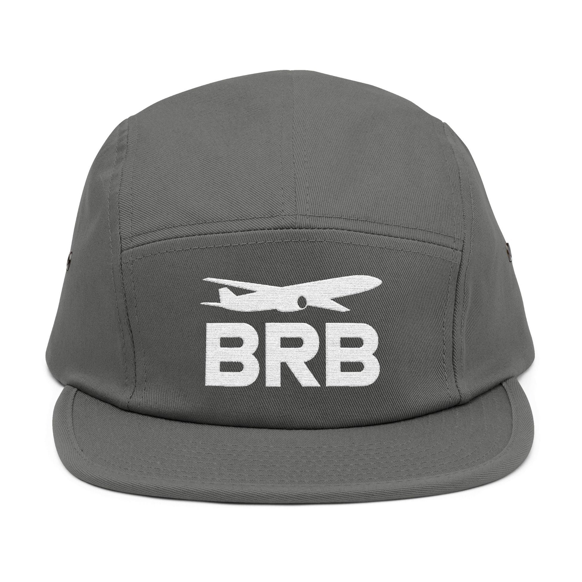 Gray cap with 'BRB' and airplane icon on a white background. Minimalist BRB airplane embroidered design for 5-panel cap by TEEZOCA