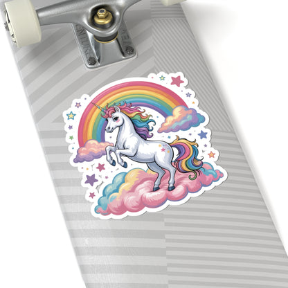 Skateboard with a unicorn and rainbow sticker on a gray background. TEEZOCA