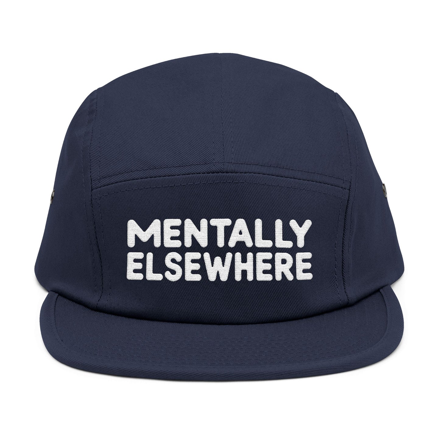 Navy blue cap with 'MENTALLY ELSEWHERE' text on a white background. Mentally Elsewhere embroidered text design on five-panel cap. TEEZOCA