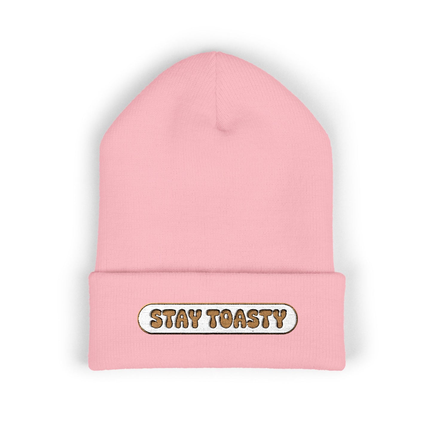 Pink beanie with 'Stay Toasty' text on a white background