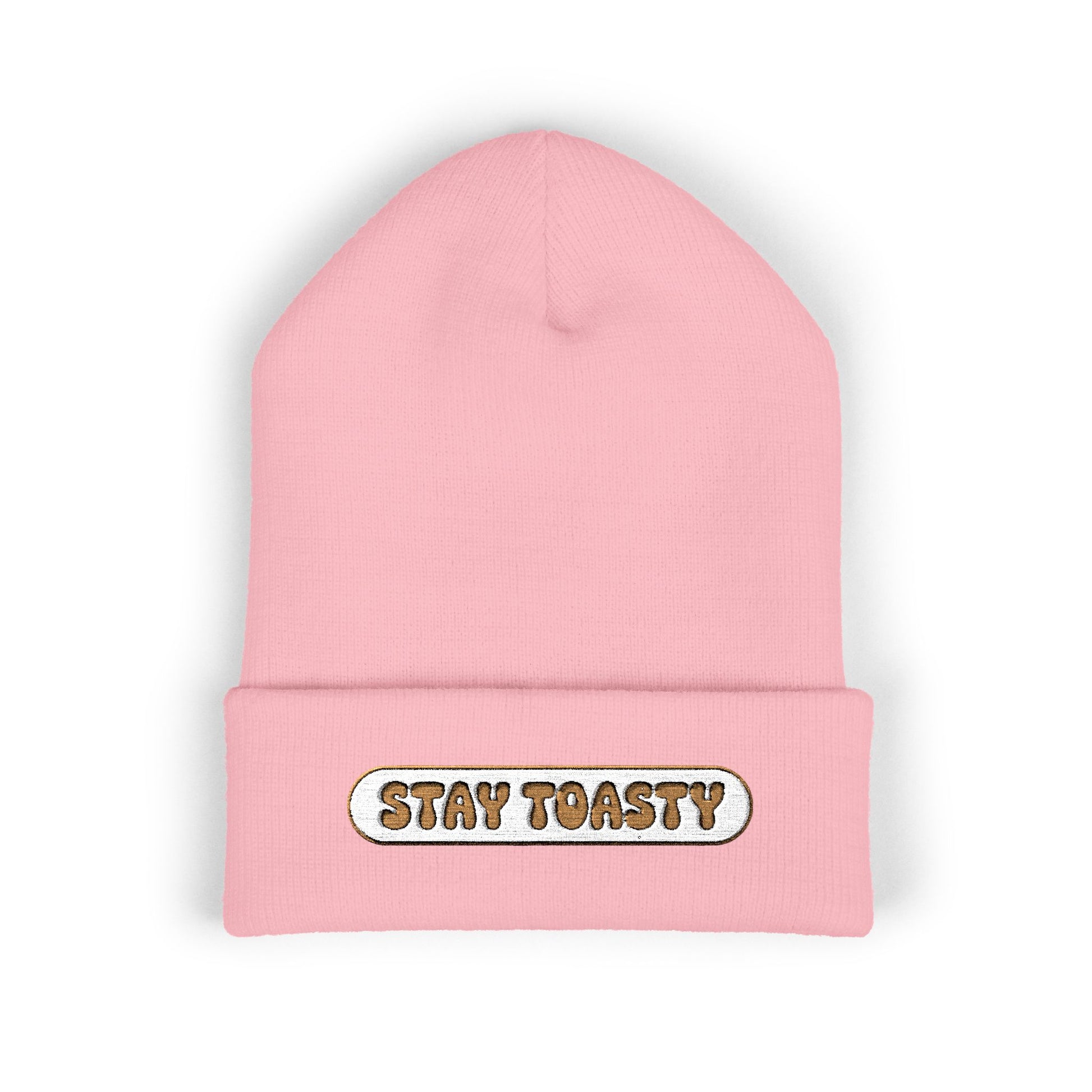 Pink beanie with 'Stay Toasty' text on a white background
