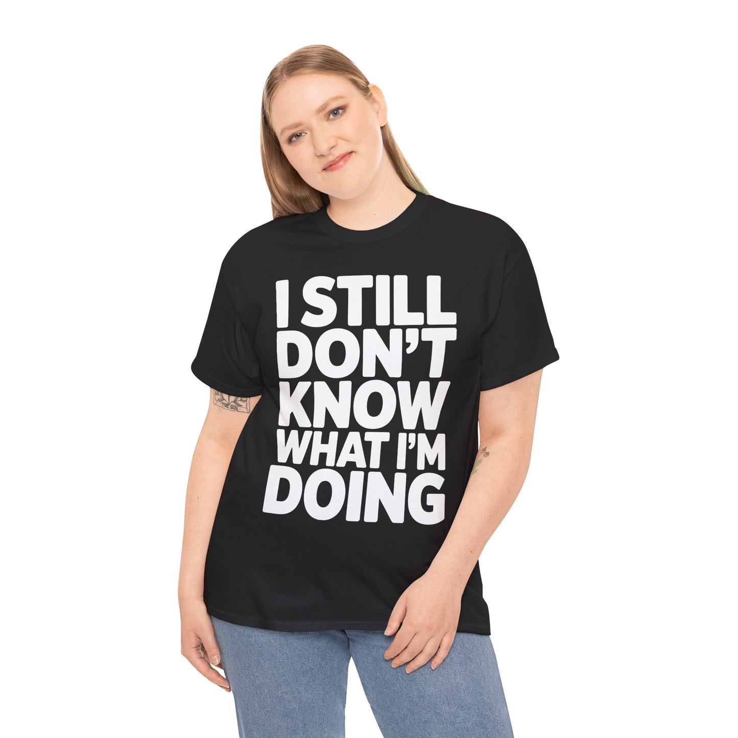 Person wearing a black t-shirt with white text 'I STILL DON'T KNOW WHAT I'M DOING' on a white background | TEEZOCA