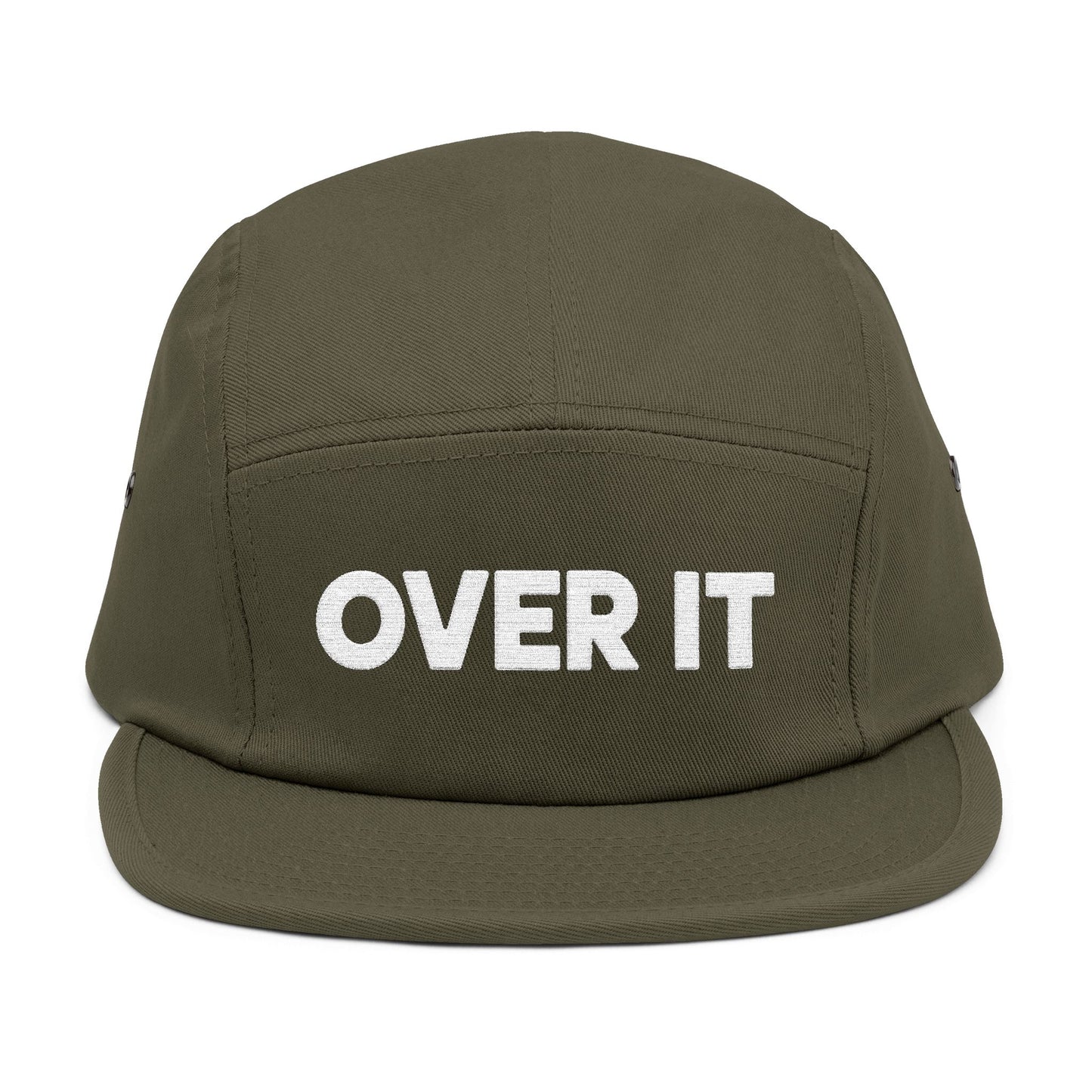 Green cap with 'OVER IT' text on a white background. OVER IT embroidered text design displayed on clean white typography. TEEZOCA