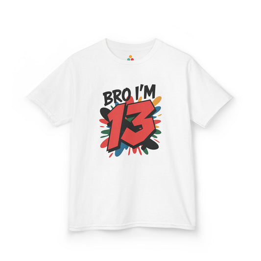 White kids’ t‑shirt with “Bro I’m 13” graffiti text, big red 13, and multicolor paint splash, flat front view