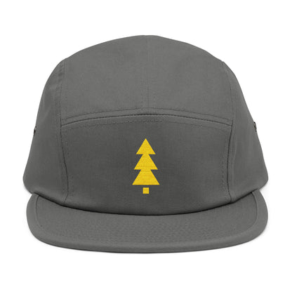 Gray cap with a yellow tree logo on a white background. Minimalist geometric Christmas tree embroidery icon in gold. TEEZOCA