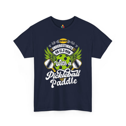 “Teezoca navy blue Never Underestimate an Old Man with a Pickleball Paddle shirt, green pickleball with wings and paddles, funny older men’s sports tee, front.”

