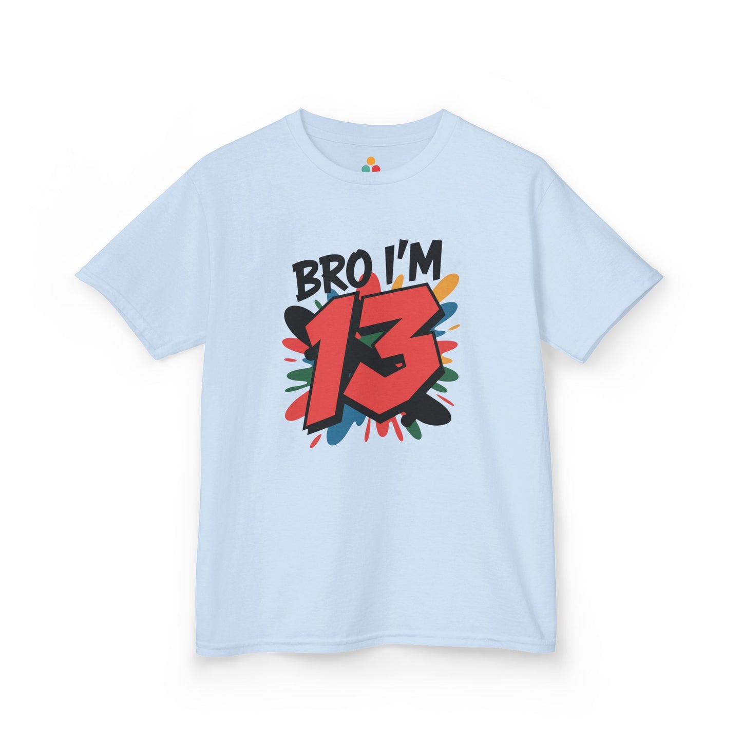  Light blue kids’ t‑shirt with “Bro I’m 13” graffiti text, big red 13, and multicolor paint splash, flat front view.