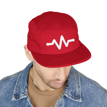Red cap with a white design worn by a person on a white background. Minimal pulse line embroidered on red five-panel cap. TEEZOCA