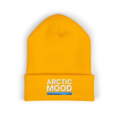 Yellow beanie with 'Arctic Mood' text on a white background