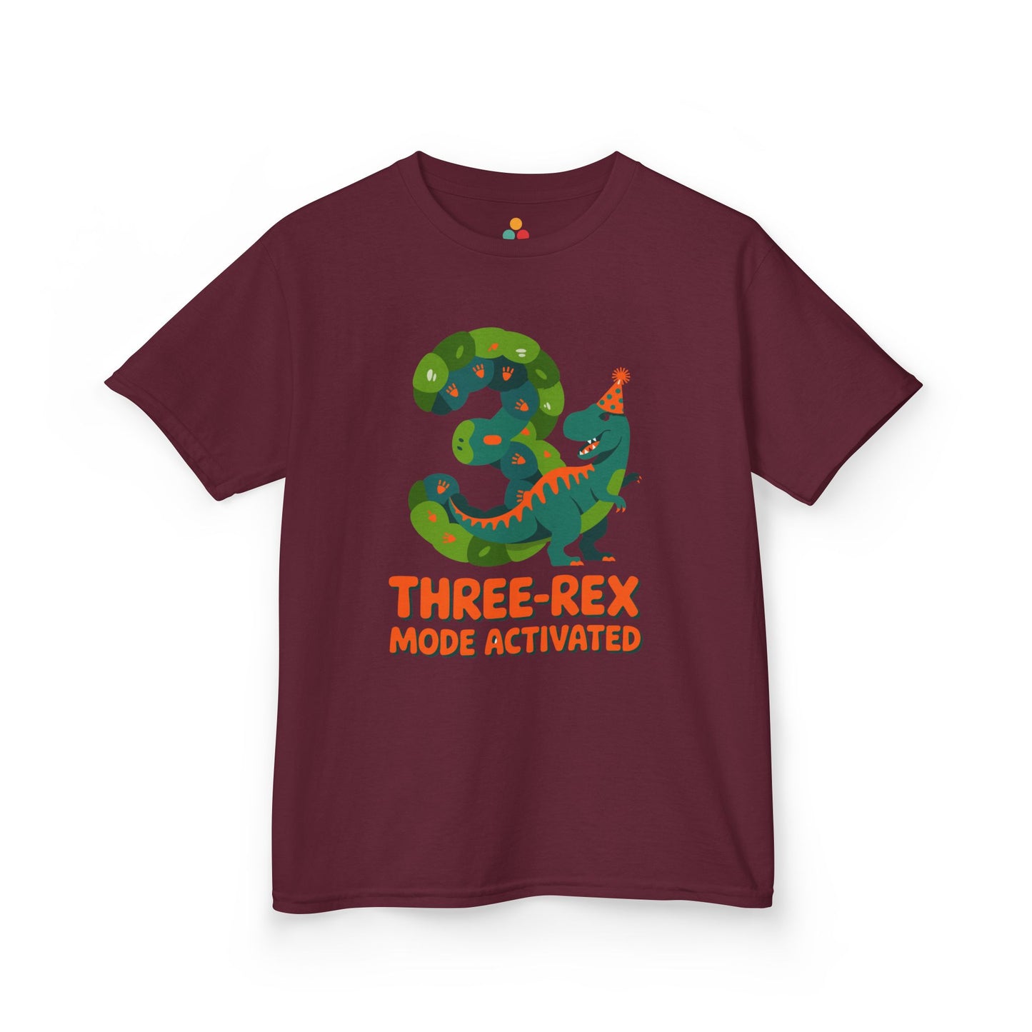 Maroon kids' t‑shirt with colorful green T‑Rex wearing party hat, confetti, and "Three-Rex Mode Activated" text, flat front view.