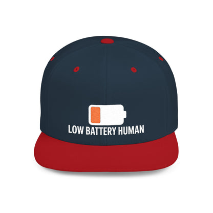 Navy and red cap with 'Low Battery Human' text and battery icon on a white background