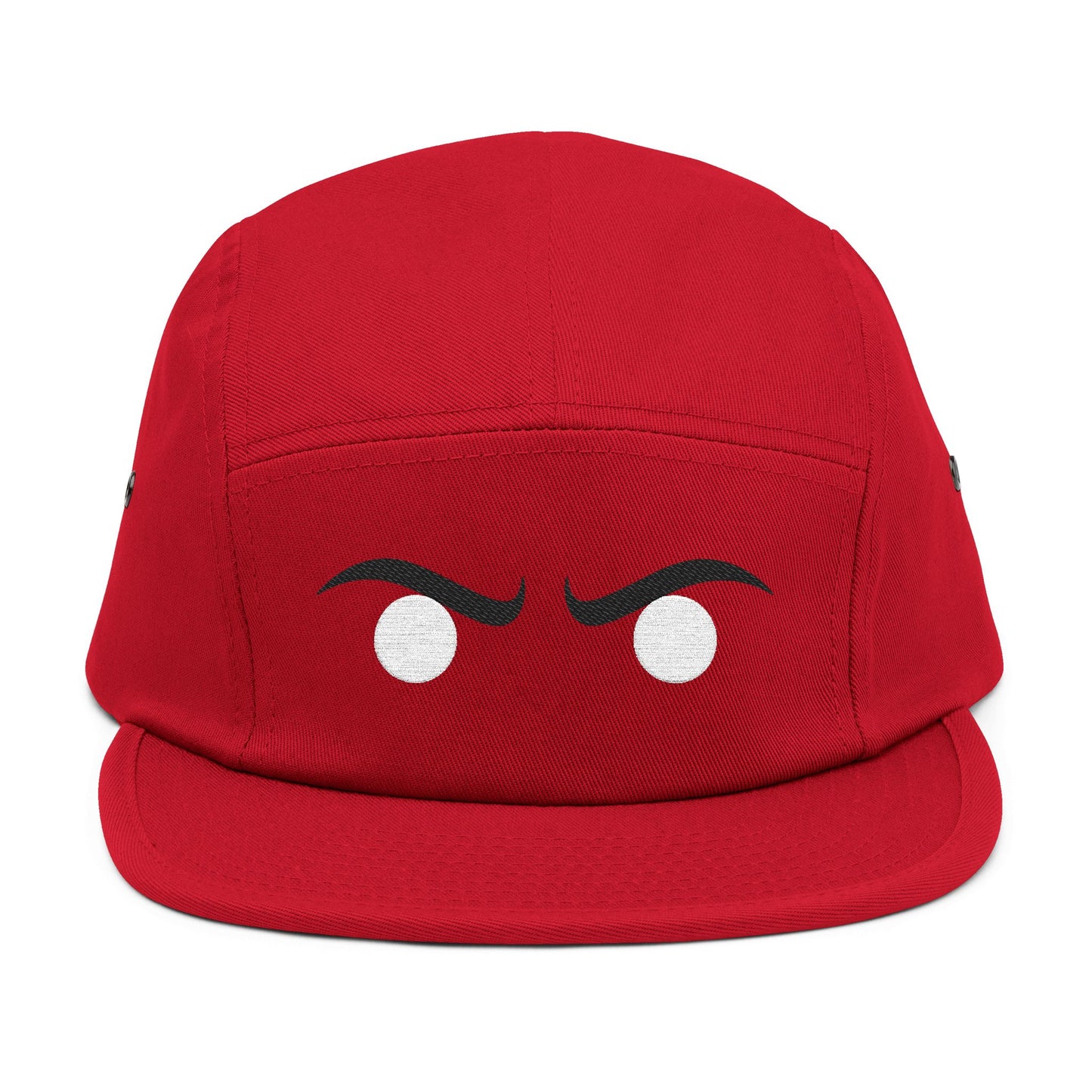 Red cap with cartoonish face design on a white background. Modern streetwear angry eyes icon in high-contrast style. TEEZOCA