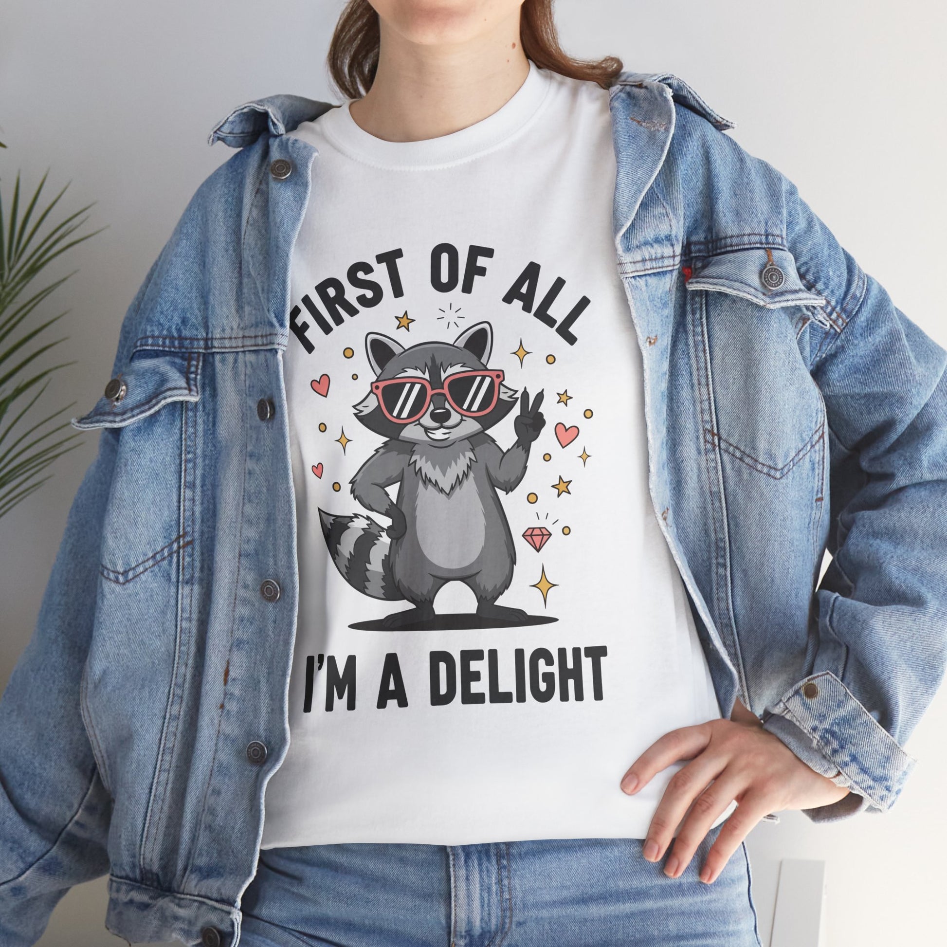 Woman in a denim jacket layering a TEEZOCA “First Of All I’m A Delight” funny t‑shirt.