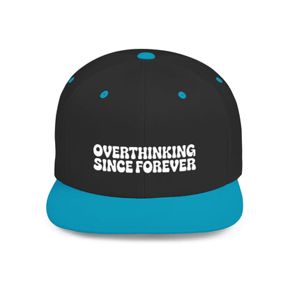 Black and blue cap with 'OVERTHINKING SINCE FOREVER' text on a white background