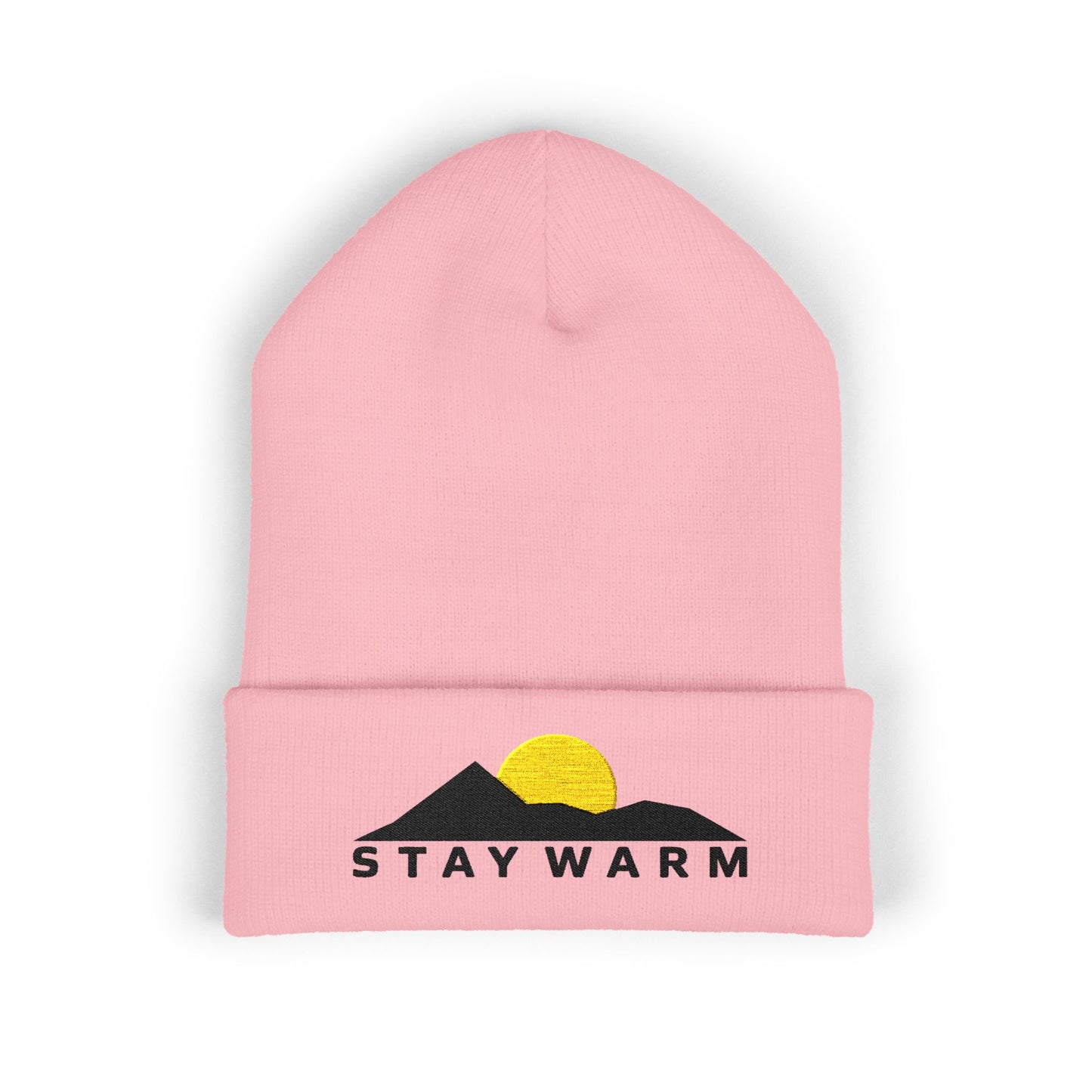 Pink beanie with 'Stay Warm' and mountain design on a white background
