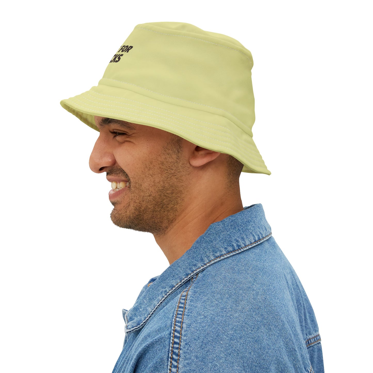 Funny sarcastic light green bucket hat with text 'JUST HERE FOR THE SNACKS' on a white background. TEEZOCA