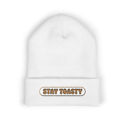 White beanie with 'Stay Toasty' text on a white background