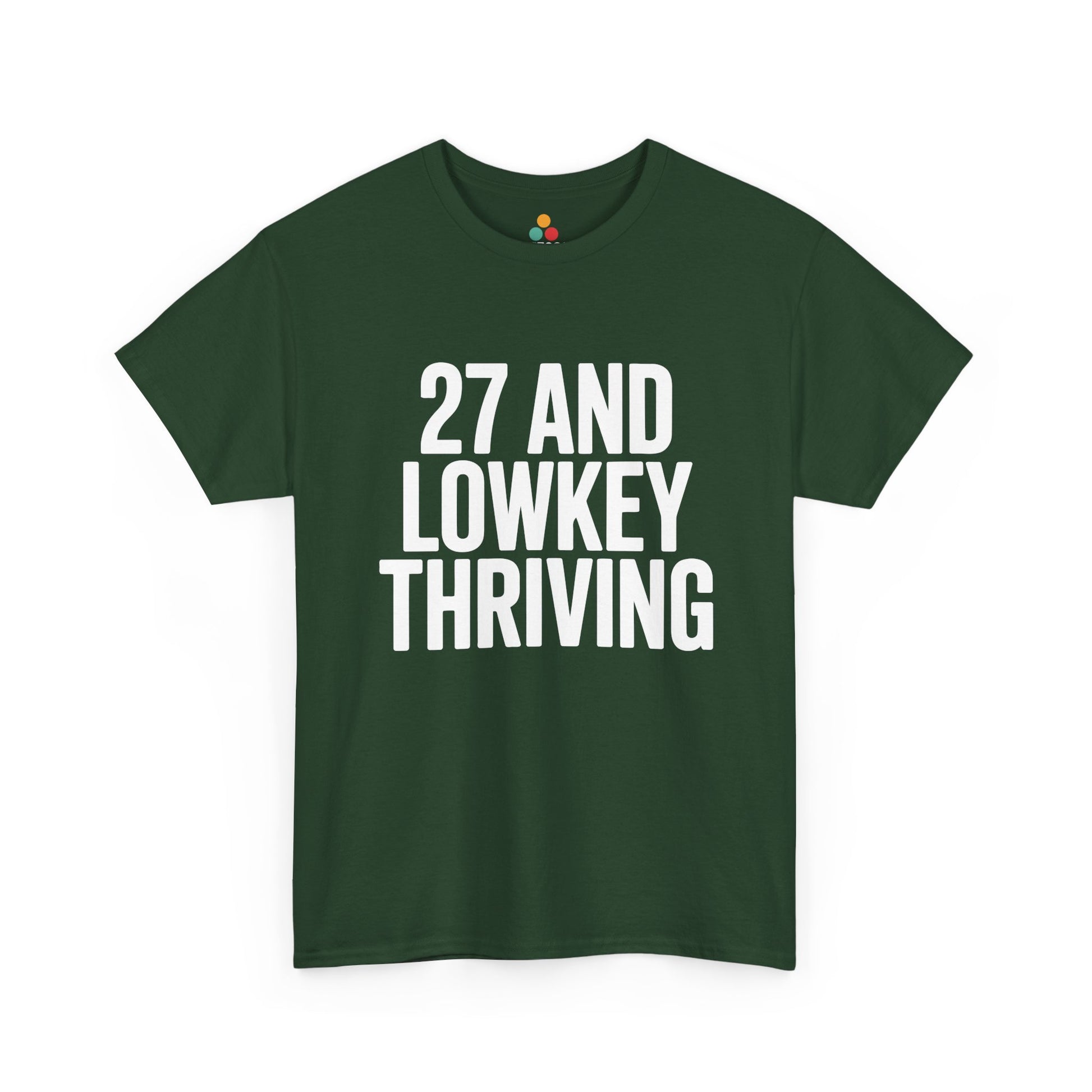 Green t-shirt with white text '27 AND LOWKEY THRIVING' on a white background