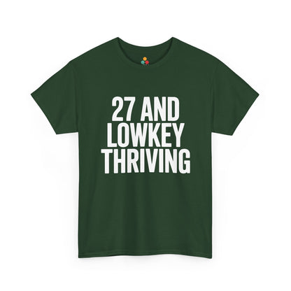 Green t-shirt with white text '27 AND LOWKEY THRIVING' on a white background