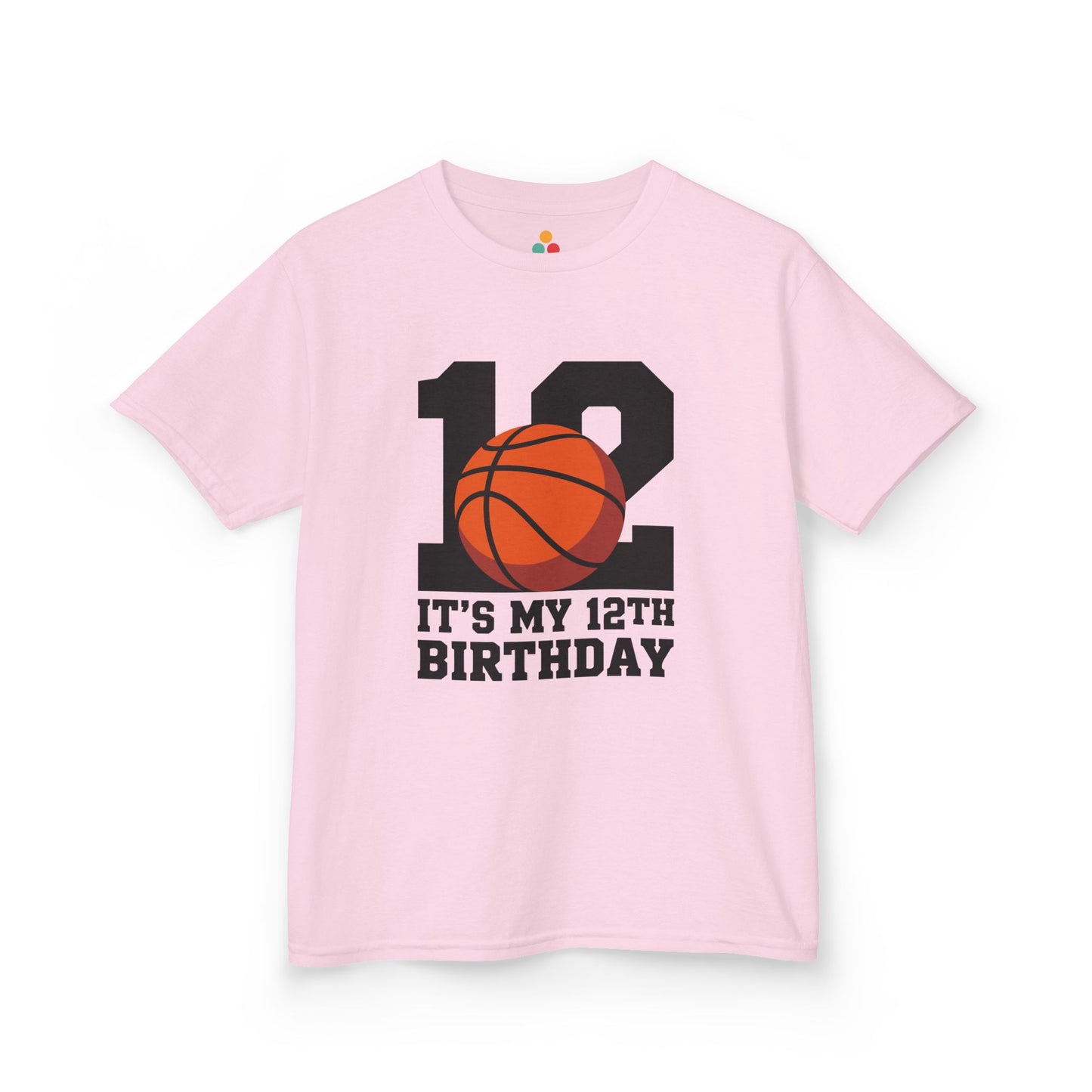 Pink kids’ t‑shirt with big black “12” and orange basketball plus “It’s My 12th Birthday” sports graphic, flat front view.