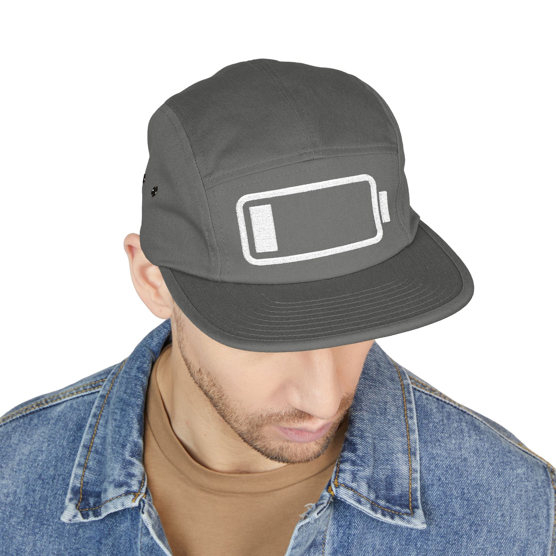 Person wearing a gray cap with a battery icon design on a white background. Minimal low battery icon embroidered on 5-panel cap. TEEZOCA