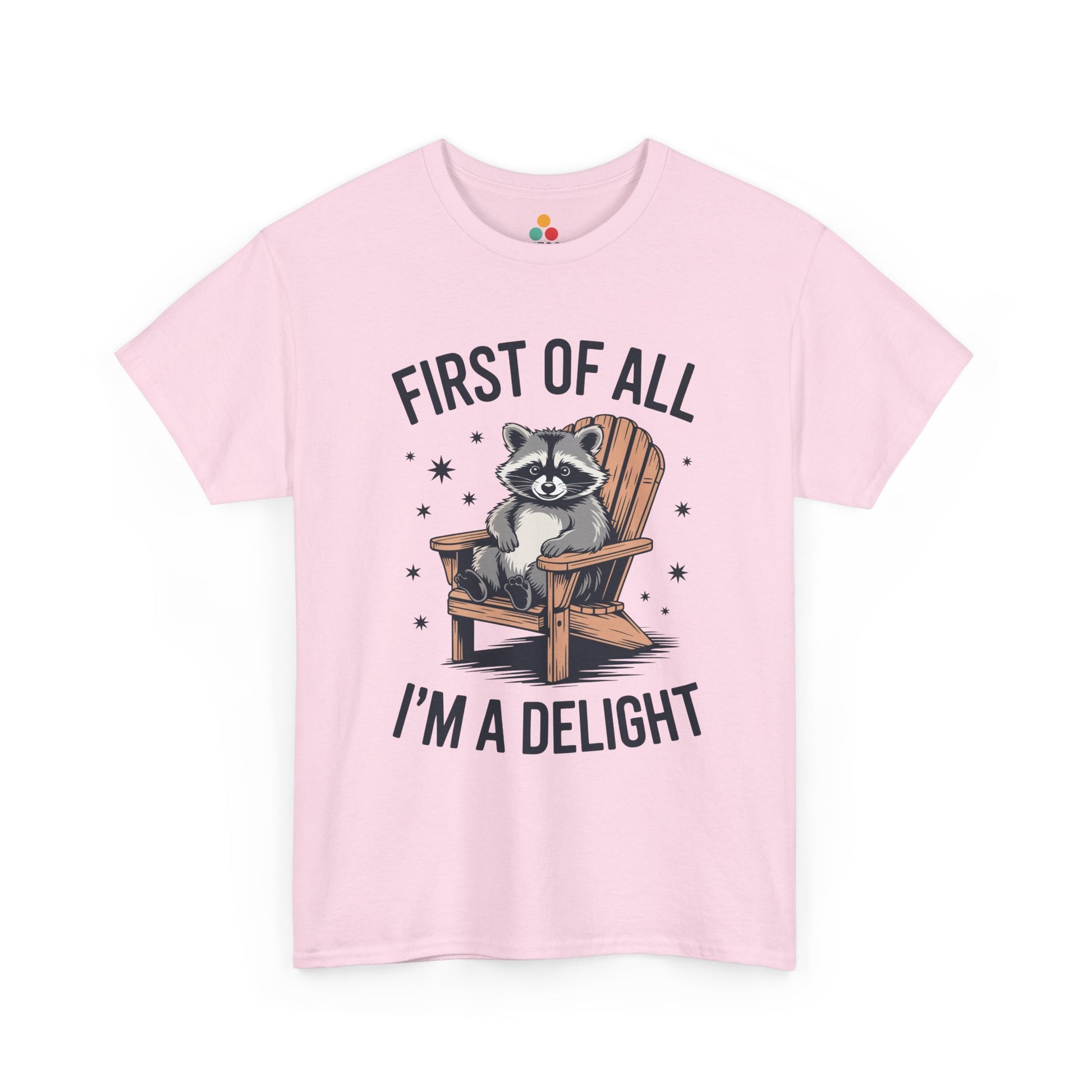 TEEZOCA pink “First Of All I’m A Delight” cute lounging raccoon tee shown flat.