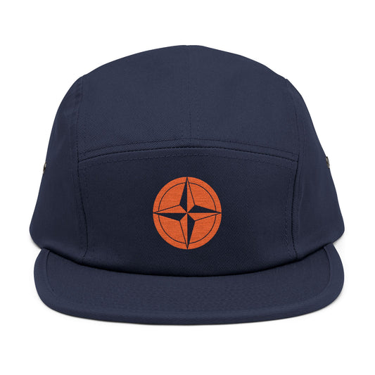 Navy blue cap with an orange circular logo on a white background. minimalist compass star icon embroidered design for 5-panel cap by TEEZOCA