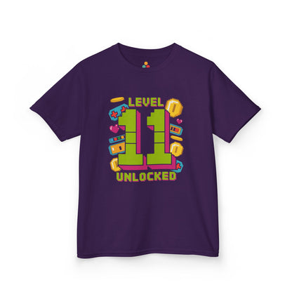 Purple kids’ t‑shirt with neon green pixel “11” surrounded by gaming icons and “Level 11 Unlocked” text, flat front view.